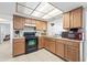 A kitchen featuring wooden cabinets and updated appliances at 7240 Nova Scotia Dr, Port Richey, FL 34668