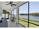 Relaxing screened porch overlooking a lake, perfect for enjoying the view at 12135 Crestridge Loop, Trinity, FL 34655