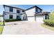 Two-story house with a three-car garage and a basketball court at 12135 Crestridge Loop, Trinity, FL 34655