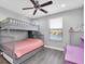 Another bedroom with a bunk bed, offering versatility for guests at 12135 Crestridge Loop, Trinity, FL 34655