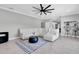 Spacious living room with sectional sofa and large TV at 12135 Crestridge Loop, Trinity, FL 34655