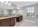 Double vanity bathroom with granite countertops at 12135 Crestridge Loop, Trinity, FL 34655