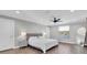 Spacious main bedroom with large window and ceiling fan at 12135 Crestridge Loop, Trinity, FL 34655