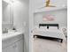 Clean bathroom with gray vanity and a view into the bedroom at 12135 Crestridge Loop, Trinity, FL 34655