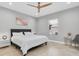 Spacious main bedroom with a king-size bed and ceiling fan at 12135 Crestridge Loop, Trinity, FL 34655