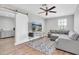 Living room with sectional sofa and ceiling fan at 12135 Crestridge Loop, Trinity, FL 34655