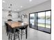 Open kitchen with large island and sliding doors to patio at 12135 Crestridge Loop, Trinity, FL 34655
