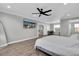 Main bedroom with a large TV and plenty of space at 12135 Crestridge Loop, Trinity, FL 34655