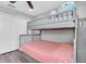 Cozy bedroom featuring a bunk bed and plenty of closet space at 12135 Crestridge Loop, Trinity, FL 34655