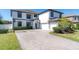 Two-story house with a brick driveway and basketball hoop at 12135 Crestridge Loop, Trinity, FL 34655