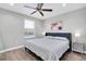 Spacious bedroom with a king-size bed and light gray walls at 12135 Crestridge Loop, Trinity, FL 34655
