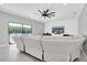 Living room with sectional sofa and lake view at 12135 Crestridge Loop, Trinity, FL 34655