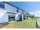 Home features a screened patio, fenced backyard, and lush landscaping at 12135 Crestridge Loop, Trinity, FL 34655