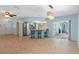 Kitchen with stainless steel appliances and light blue cabinets at 3018 Greynolds Ave, Spring Hill, FL 34608