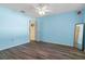 Bedroom with wood-look flooring and ceiling fan at 3018 Greynolds Ave, Spring Hill, FL 34608
