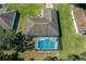 Home with a screened pool in the backyard at 3018 Greynolds Ave, Spring Hill, FL 34608