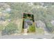 Bird's-eye view of a house with a pool, showcasing its location and lot size at 3018 Greynolds Ave, Spring Hill, FL 34608