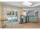Kitchen with pool view and access to backyard at 3018 Greynolds Ave, Spring Hill, FL 34608