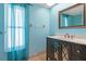 Bathroom boasts modern vanity and a large mirror at 3018 Greynolds Ave, Spring Hill, FL 34608