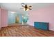 Bright living room with light wood floors and a view into the kitchen at 3018 Greynolds Ave, Spring Hill, FL 34608