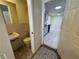 Small half bathroom with tile floors and a toilet at 5319 Whippoorwill Dr, Holiday, FL 34690