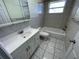Bright bathroom featuring a shower/tub combo and vanity at 5319 Whippoorwill Dr, Holiday, FL 34690