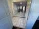 Clean entryway with tile floors and views to living room at 5319 Whippoorwill Dr, Holiday, FL 34690