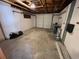 Unfinished garage with overhead door and ample storage space at 5319 Whippoorwill Dr, Holiday, FL 34690
