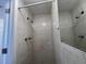Clean bathroom with tile shower and mirror at 5319 Whippoorwill Dr, Holiday, FL 34690