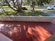 Front patio with decorative concrete wall at 5319 Whippoorwill Dr, Holiday, FL 34690