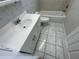 Clean bathroom with a bathtub, toilet and vanity at 5319 Whippoorwill Dr, Holiday, FL 34690
