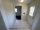 Bright entryway with tile floors and access to other rooms at 5319 Whippoorwill Dr, Holiday, FL 34690