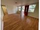 Spacious living room with hardwood floors and lots of natural light at 5319 Whippoorwill Dr, Holiday, FL 34690