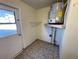Laundry room with washer/dryer hookups and exterior access at 5319 Whippoorwill Dr, Holiday, FL 34690