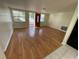 Bright living room featuring hardwood floors and an open layout at 5319 Whippoorwill Dr, Holiday, FL 34690