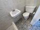 Clean bathroom with toilet, sink, and shower at 5319 Whippoorwill Dr, Holiday, FL 34690