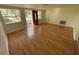 Living room with hardwood floors and access to the front porch at 5319 Whippoorwill Dr, Holiday, FL 34690