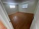Bright bedroom with laminate flooring and window coverings at 5319 Whippoorwill Dr, Holiday, FL 34690