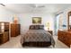 Comfortable bedroom with a double bed and wood furniture at 6424 Lost Tree Ln, Spring Hill, FL 34606