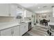 Modern kitchen with white cabinets, quartz countertops and stainless steel appliances at 5110 Colchester Ave, Spring Hill, FL 34608