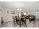 Open concept dining room with table and chairs, connected to living room at 5110 Colchester Ave, Spring Hill, FL 34608