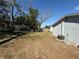 Large backyard with grass and mature trees at 4041 Las Vegas Dr, New Port Richey, FL 34653
