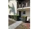 Condo building entrance with walkway and shrubs at 5521 Bay Blvd # 101, Port Richey, FL 34668