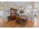 Elegant dining room with hardwood floors, wood table and chairs, and hutch at 13517 Hunters Point St, Spring Hill, FL 34609