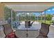Relaxing screened patio with seating area, perfect for outdoor enjoyment at 13517 Hunters Point St, Spring Hill, FL 34609