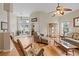 Open living room with hardwood floors, comfortable seating, and access to backyard at 13517 Hunters Point St, Spring Hill, FL 34609