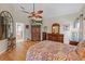 Spacious Primary bedroom with hardwood floors and ensuite bathroom access at 13517 Hunters Point St, Spring Hill, FL 34609