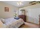 Comfortable bedroom with a ceiling fan and built in closet at 13517 Hunters Point St, Spring Hill, FL 34609