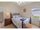 Charming bedroom with an ornate bed frame and wood furniture at 13517 Hunters Point St, Spring Hill, FL 34609
