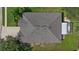 Top-down view of the house, highlighting the roof and screened enclosure at 13517 Hunters Point St, Spring Hill, FL 34609